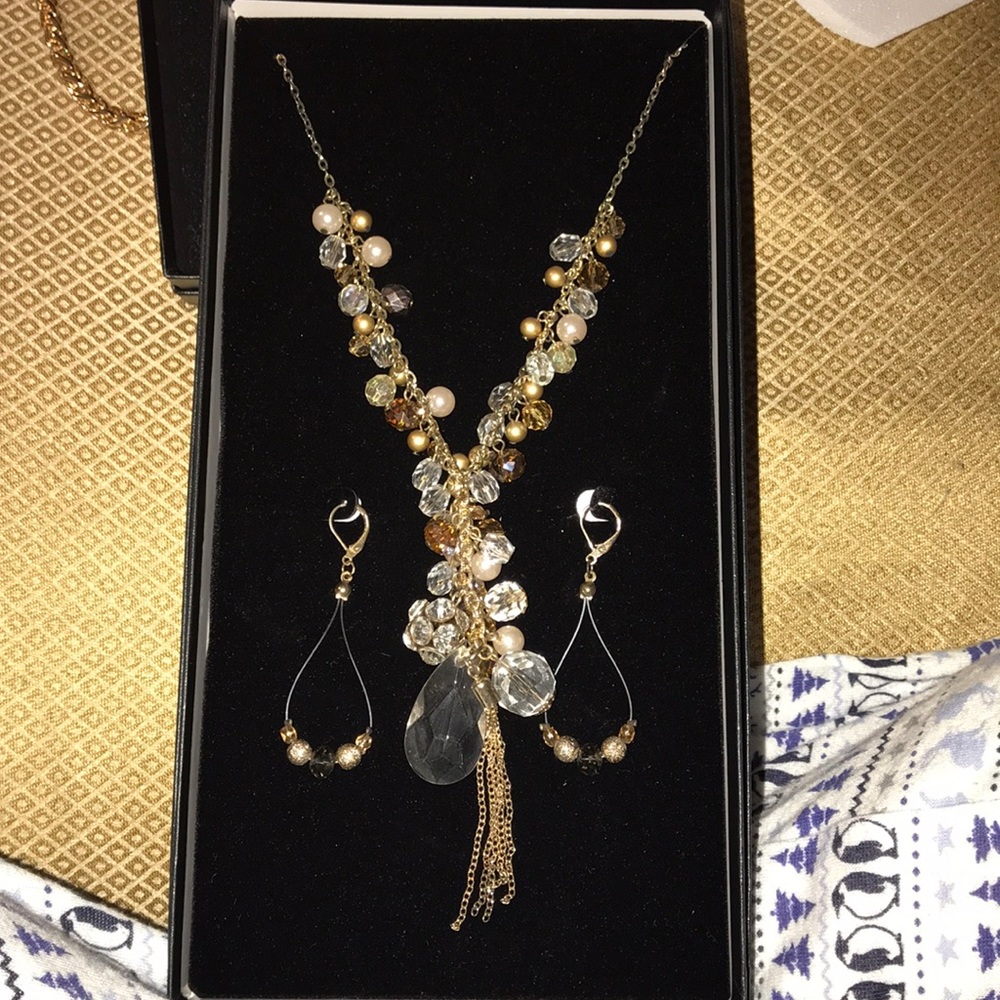 Gold long necklace with pearls. & long earrings.